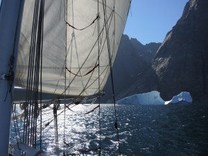 Our Sailrite built main, driving the hull through pins Christian Sound.  Southern Greenland 2015