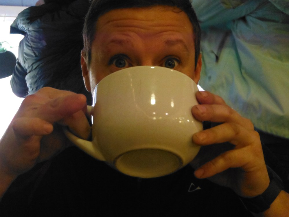 Note the raised stumpy finger.  Thats classy.