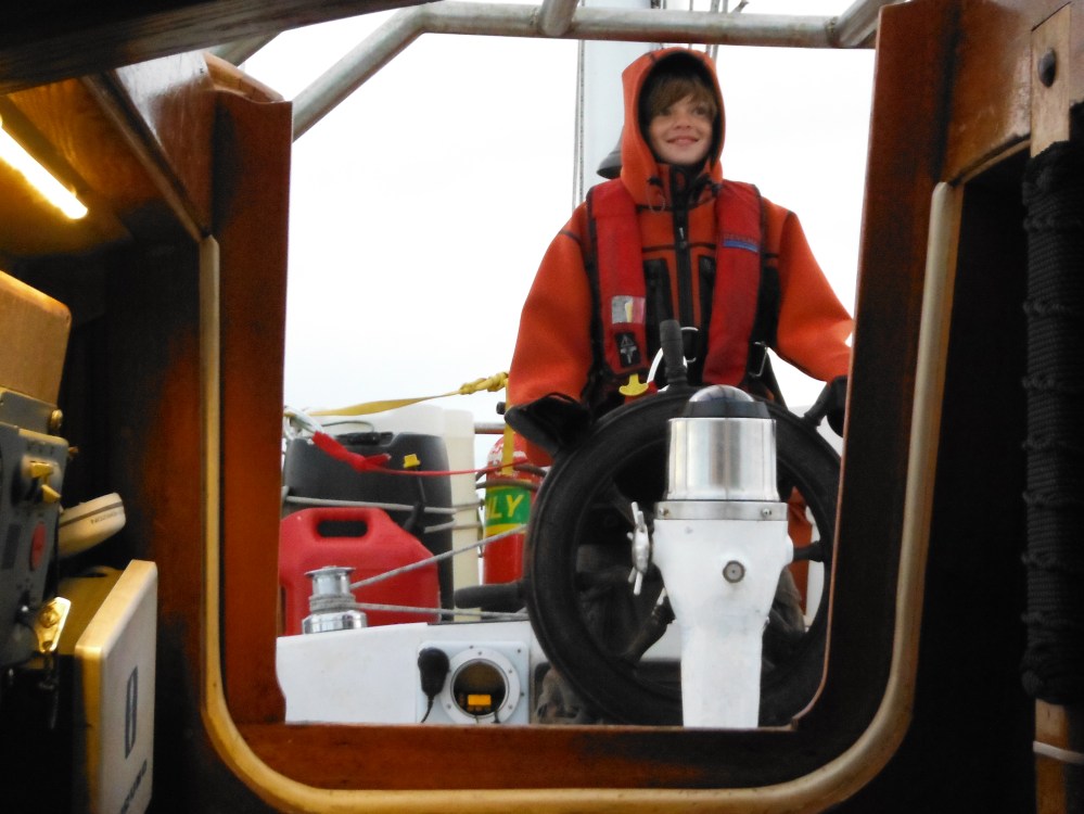 Steve snickers as he sports my jacket without my knowledge. 