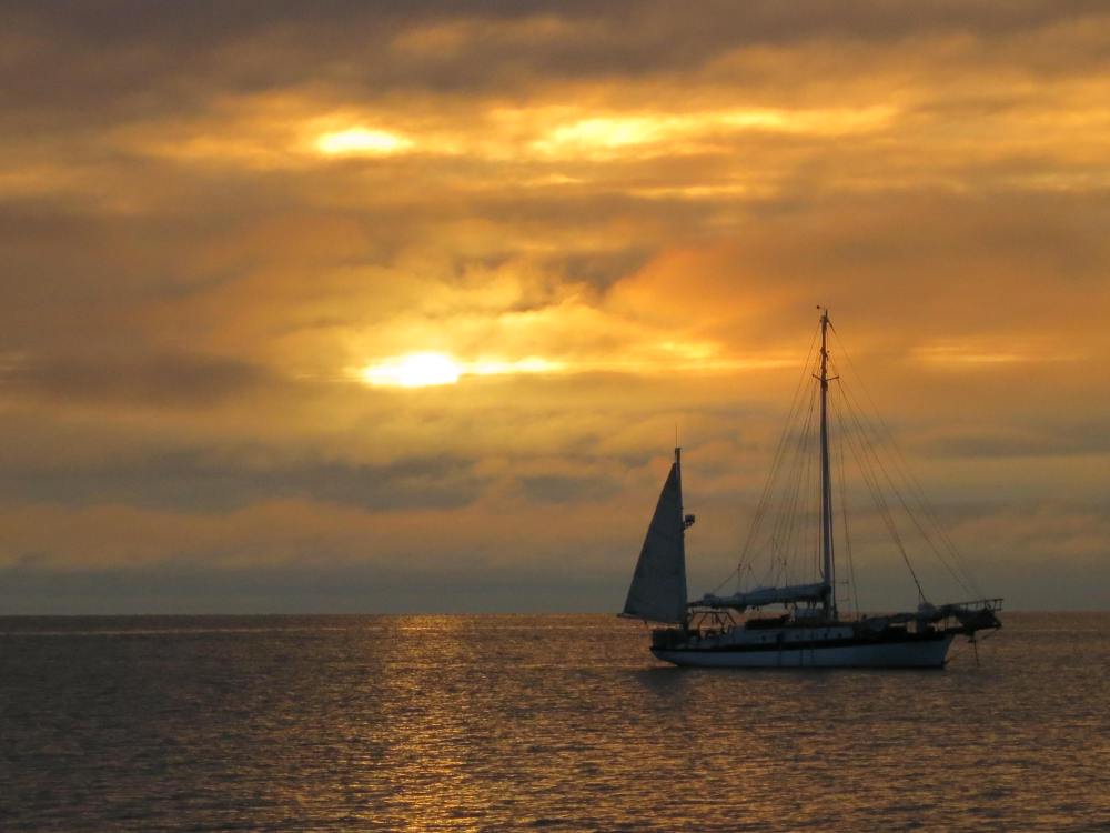 The closest thing we get to sunset in the Arctic Summer.  Photo by Will Watson while ferrying drums of fuel aboard, in the Scarlet Letter.