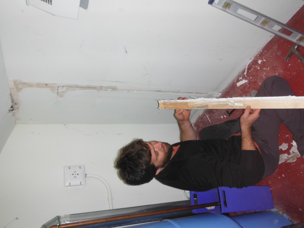 Jason doing some drywall for our friends.