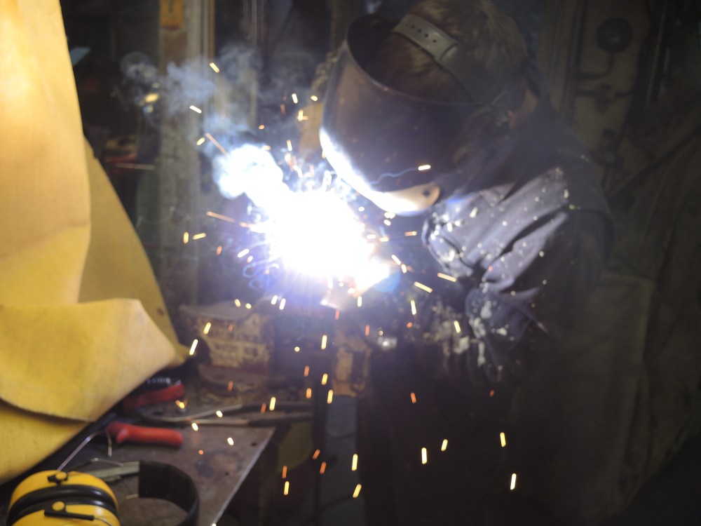 Welding the mass together.