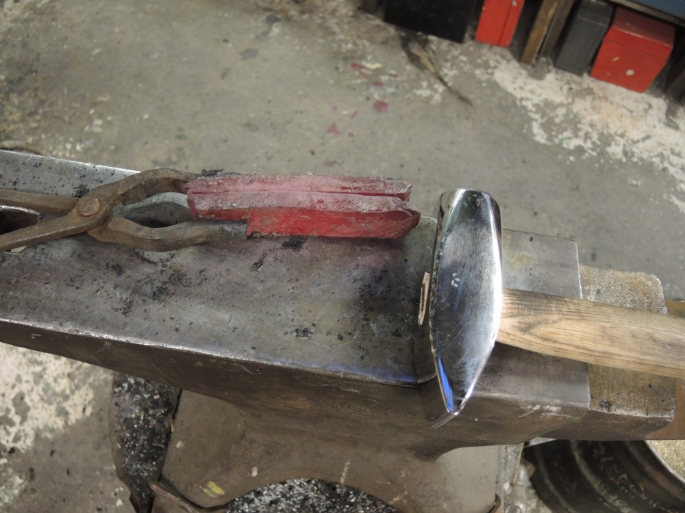 Hand folding on the anvil.