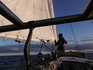 Samantha tending reef lines at the main boom